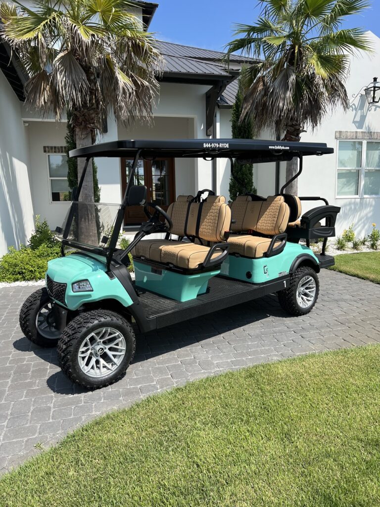 a turquoise 6 passenger golf cart parked in front of a house in Santa Rosa Beach, Fl